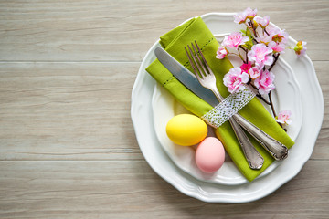 Wall Mural - Easter table setting with spring flowers and cutlery