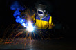 © phonix_a - worker with protective mask welding metal.