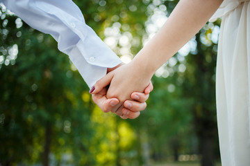 Summer holidays, love, relationship and dating concept. Holding hands