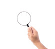 © Johnstocker - Hand holding magnifying glass