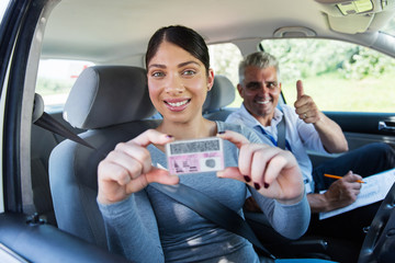 Wall Mural - woman holding driver's license