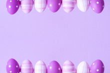 Purple Easter Eggs Over Purple Background