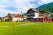 Guest houses on shore of Weissensee lake in summer landscape of Carinthia land, Austria