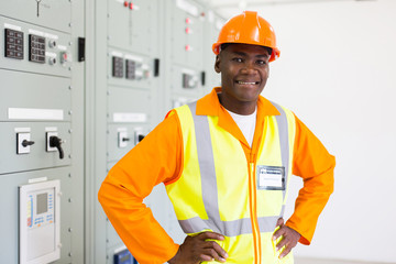 Wall Mural - african electrician standing in power plant control room
