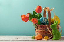 Easter Holiday Basket With Eggs, Flowers And Easter Bunny