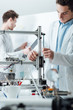 © StockPhotoPro - Engineers in the lab using a 3D printer