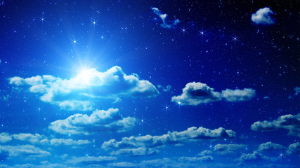 Wall Mural - Stars on a dark sky with some clouds.