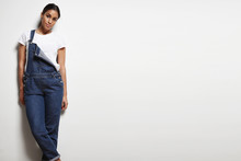 Woman Wears Overalls On A White Background