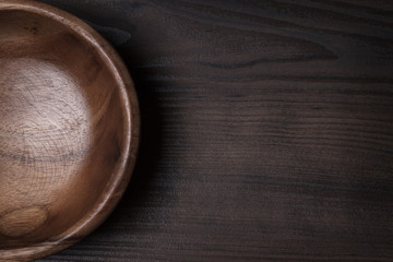 Wall Mural -  wooden salad bowl on the brown table