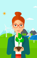 Poster - Woman holding plant.