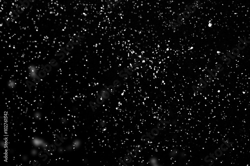 Fotografía Falling snow isolated on black background