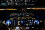 Fototapeta Londyn - Final approach at night - landing plane flight deck view