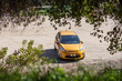 Beautiful Yellow Ford Fiesta Parked in a Dirty Road Frames With