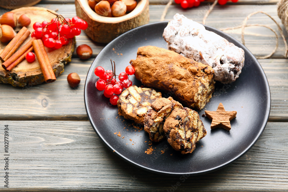 Chocolate salami in a plate on a wooden background Stock Photo | Adobe ...