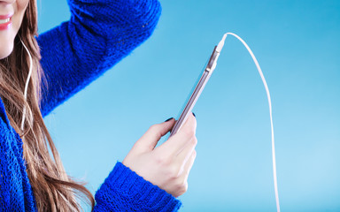 Wall Mural - young woman with smart phone listening music