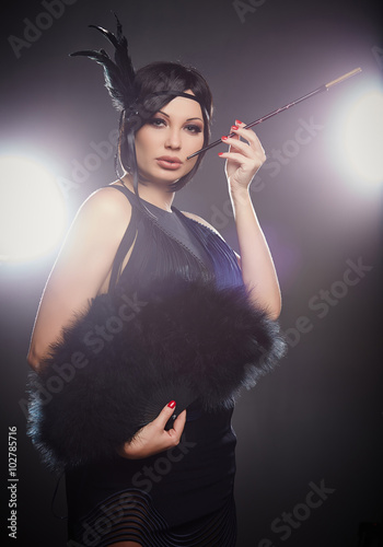 Fotografia Portrait of old fashioned woman with cigarette.