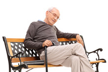 Senior With Cane Sleeping On A Wooden Bench
