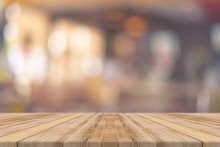 Wooden Board Empty Table In Front Of Blurred Background. Perspective Brown Wood Over Blur In Restaurant - Can Be Used For Display Or Montage Your Products.Mock Up For Display Of Product.