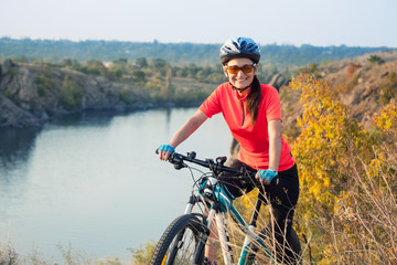 Happy adult woman cyclist.