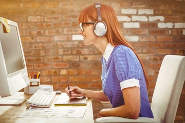 Poster - Composite image of hipster woman with headset using graphic tablet