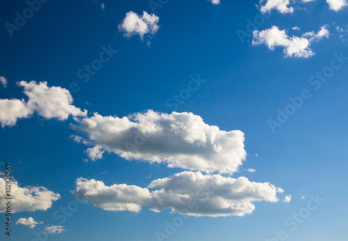 Naklejka na drzwi white fluffy clouds in the blue sky