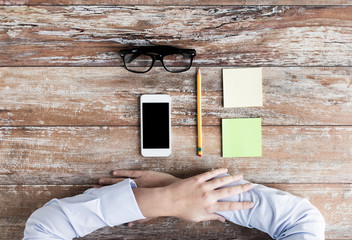 Wall Mural - close up of hands with office stuff on table