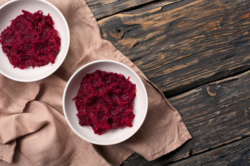 two bowls of salad with beets