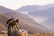 © fabio lamanna - Woman reading trekking map at panoramic spot on the Alps