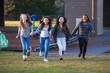 © Mat Hayward - Group of happy kids running outside
