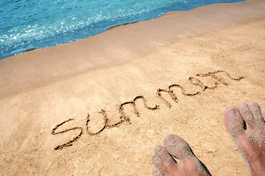 Conceptual hand made or handwritten text in sand