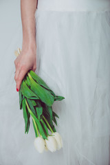 Wall Mural - Wedding bouquet of tulip flowers, young bride holding a bouquet of white tulips. 