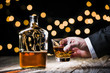 © goodmanphoto - a businessman holding a glass of whiskey
