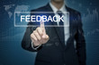© tonefotografia - Businessman hand touching FEEDBACK button on virtual screen
