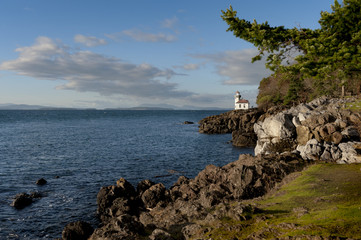 Wall Mural - Line Kiln Lighthouse. Located on San Juan Island, in Washington state, It guides ships through the Haro Straits and is part of Lime Kiln Point State Park. It overlooks Dead Mans Bay.