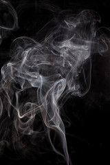 White smoke on a black background.