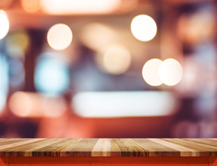 Aufkleber - Empty brown wood table top with red trim at blur restaurant boke