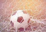 Fototapeta Sport - Football in goal.Process in vintage color tone