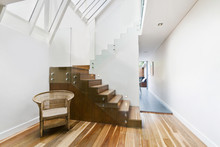 Image Of Solid Wooden Stairs With Elegant Glass Balustrade