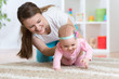 Funny crawling baby girl with mother