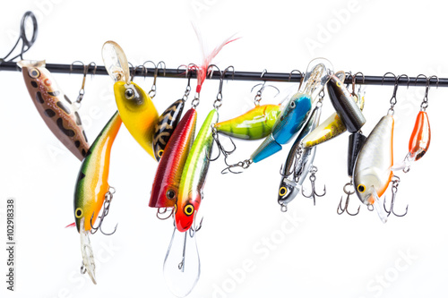 Cuadros en Lienzo colored fishing bait wobblers be suspended on rod`s blank