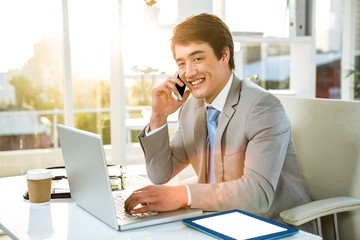 Poster - Portrait of asian businessman using phone 