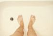 © gorkos - Photo of man's feet in the shower