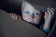 © natalinka29 - Little boy peeking out of a cardboard box