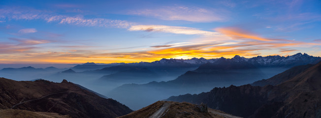 Wall Mural - Mountain silhouette and stunning sky at sunset, panorama