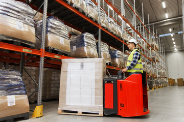 Wall Mural - man on forklift loading cargo at warehouse