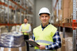 © Syda Productions - man with clipboard in safety vest at warehouse