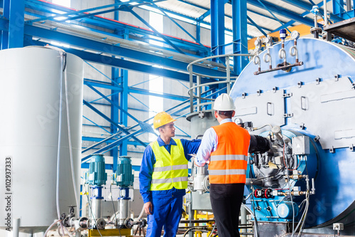 Fotografie, Obraz Worker and manager in industrial factory