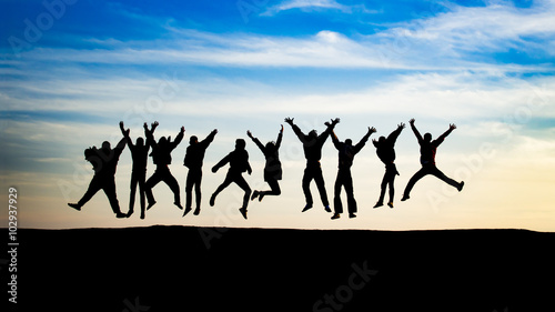 Cuadros en Lienzo group of young people is jumping on top of the mountain