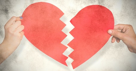 Poster - Composite image of two hands holding broken heart