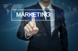 © tonefotografia - Businessman hand touching MARKETING button on virtual screen